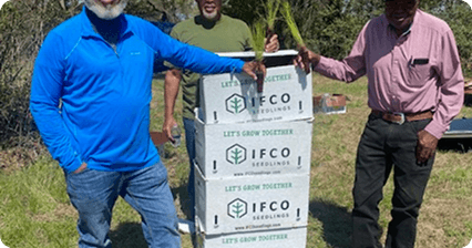 People holding IFCO box
